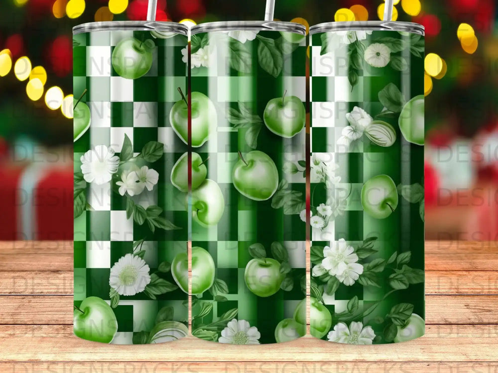 Green apples and white flowers on a checkered green background tumbler.