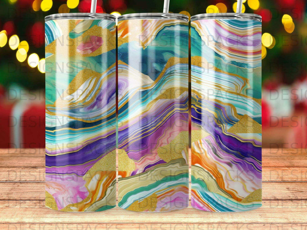 Three tumblers with abstract mountain landscape design in bright, swirling colors.