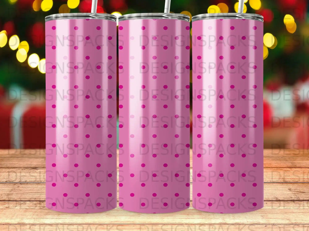 Three pink polka dot tumblers with repeating "DESIGNSPACKS" watermark.