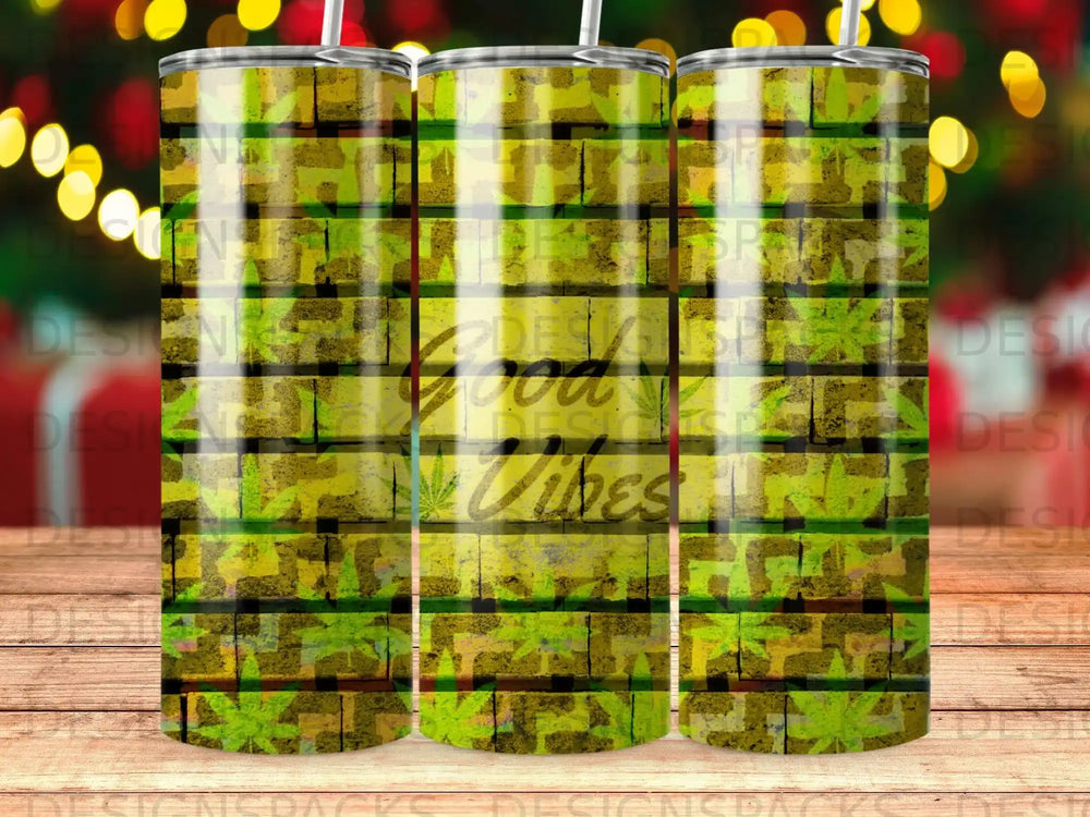 Tumbler with green wood grain and cannabis leaf pattern, says "Good Vibes".