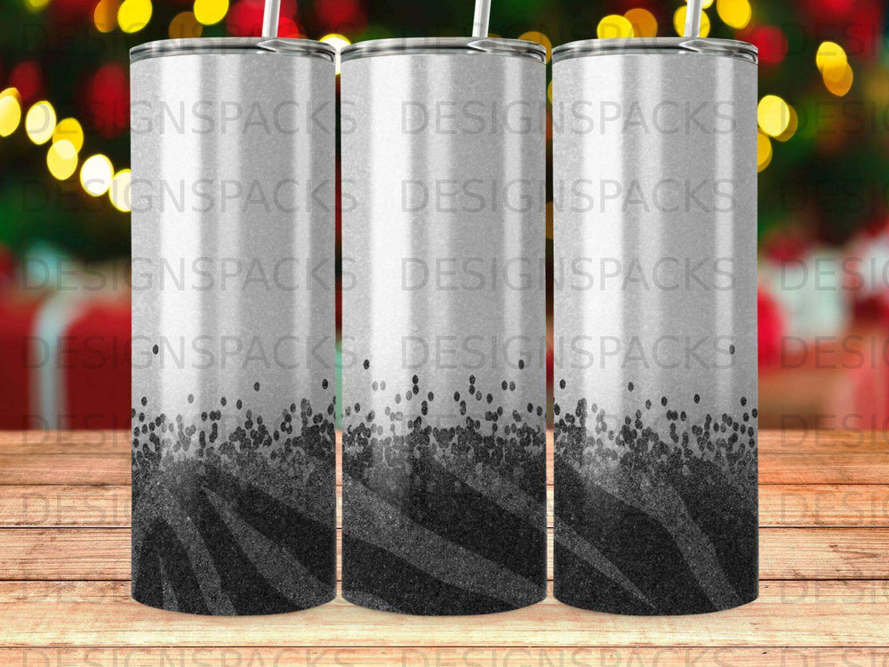 Three tumblers with black and white zebra pattern and glitter detail.