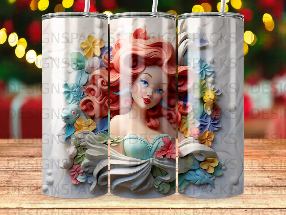 Ariel from The Little Mermaid on a patterned tumbler with colorful floral accents.