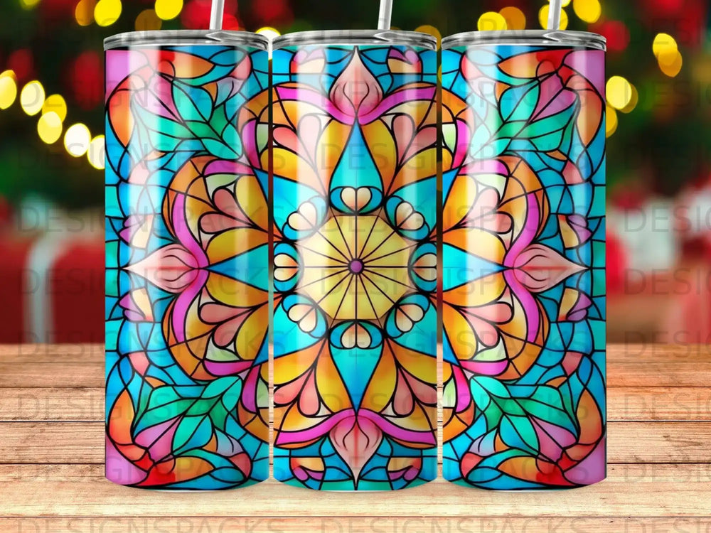 Stained glass mandala pattern tumbler with bokeh background.