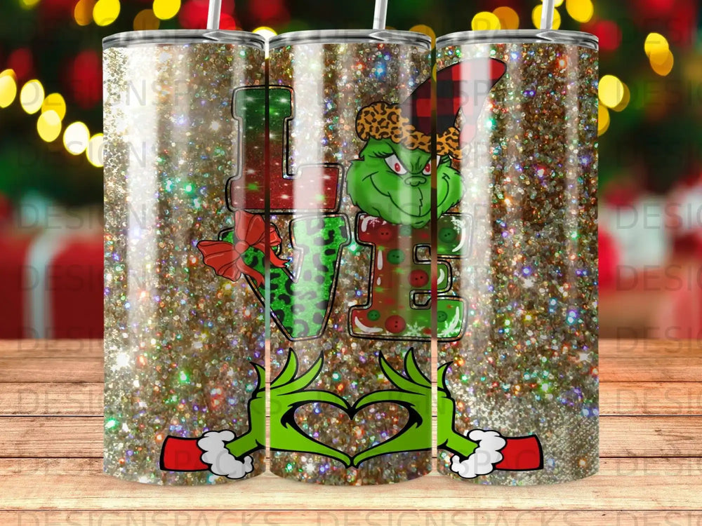 Grinch in heart shape holding glittery "LOVE" design with Christmas accents.