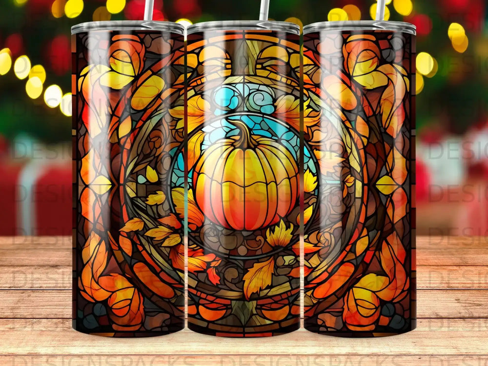 Stained glass pumpkin and autumn leaves design on a tumbler.