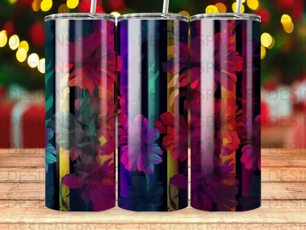 Tumbler with floral pattern against dark, colorful striped background.