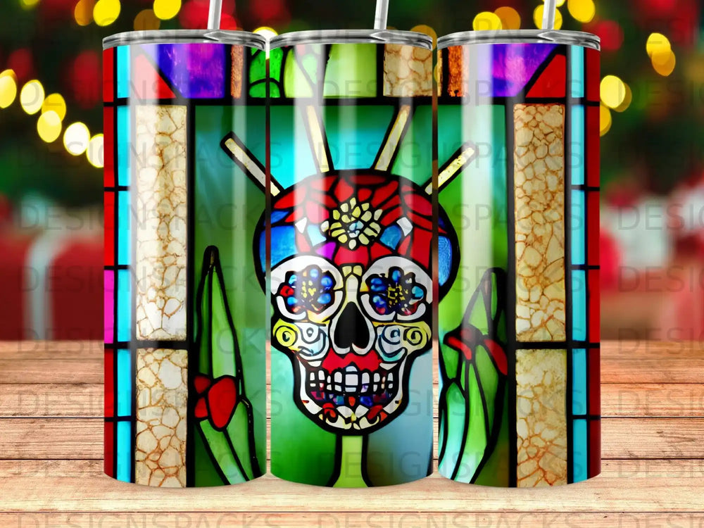 Stained glass sugar skull design on a tumbler with colorful lights.