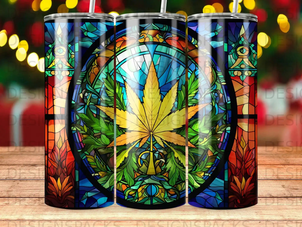 Stained glass tumbler with a cannabis leaf design and festive lights.
