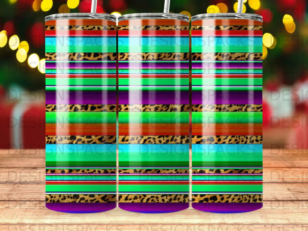 Rainbow and leopard print tumbler with green, purple, and blue stripes.