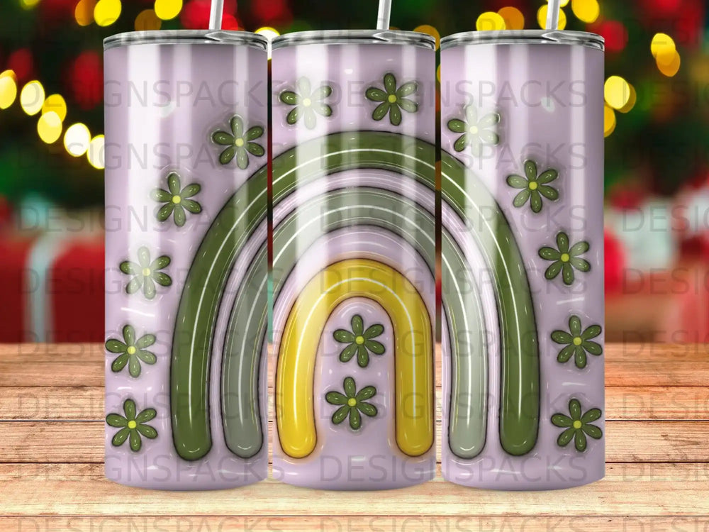 Tumbler with green and pink rainbow and floral pattern.