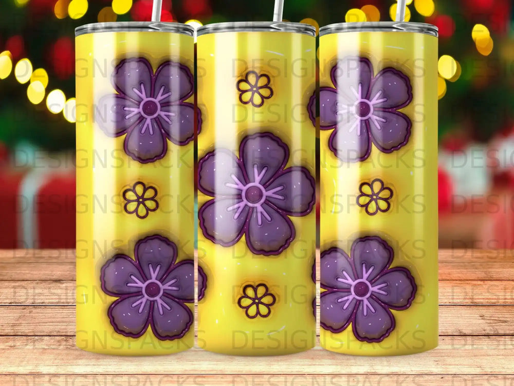 Yellow tumbler with repeating purple floral pattern and subtle bokeh background.