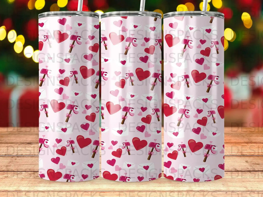 Three pink tumblers with hearts and mailboxes.