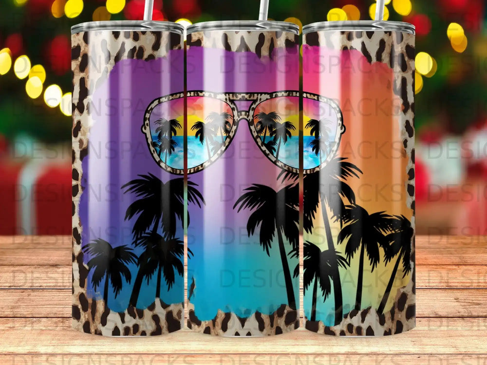 Tumbler with leopard print, sunglasses reflecting a beach scene with palm trees.