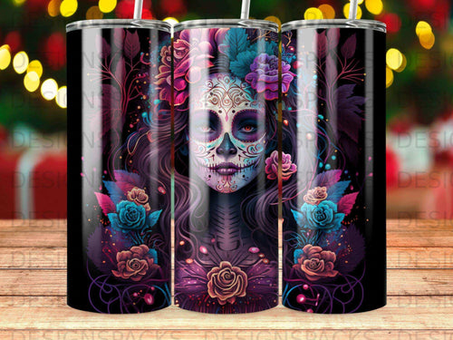 Day of the Dead skull art with flowers on a black tumbler.