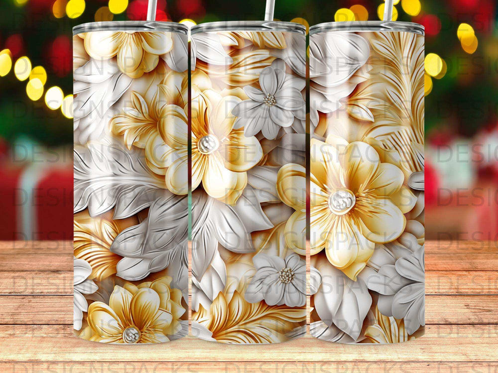 3D floral design on a tumbler with golden and white raised flowers and leaves.