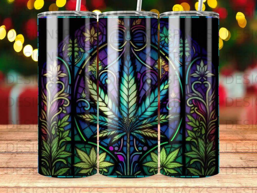 Stained glass tumbler with marijuana leaf design and colorful border.