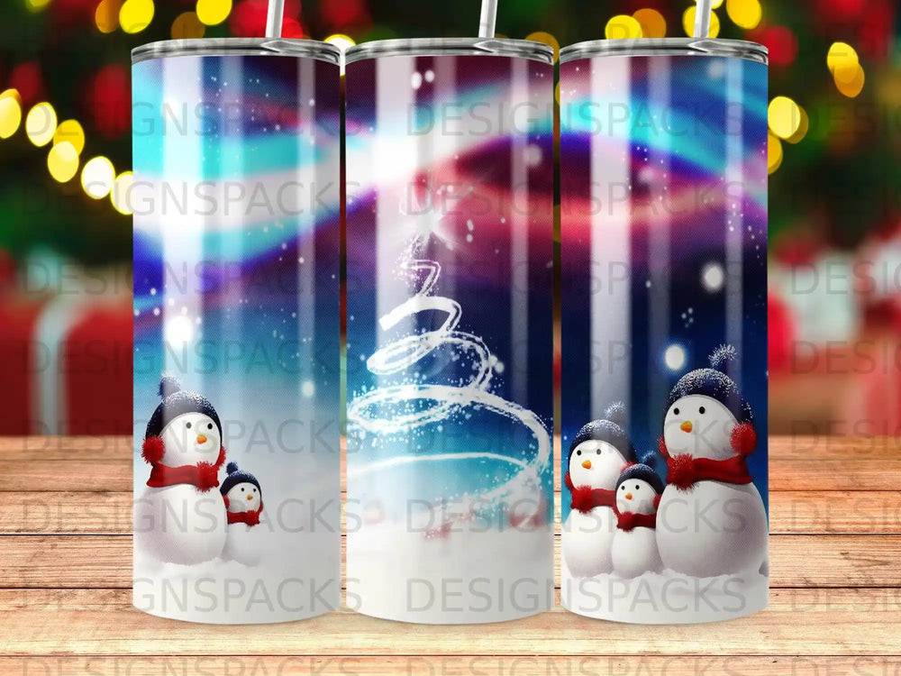 Tumbler with snowmen and snowflakes on a dark background.