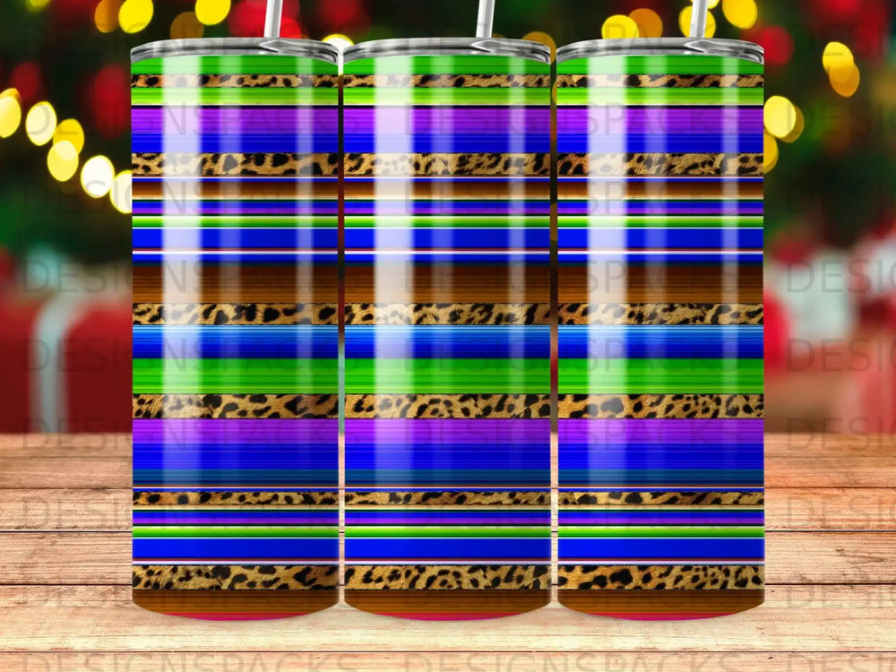 Multi-colored striped tumbler with leopard print accents.