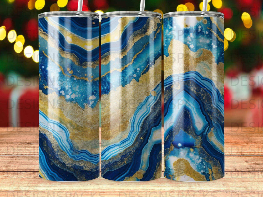 Blue and gold agate pattern on a straight tumbler with a straw.