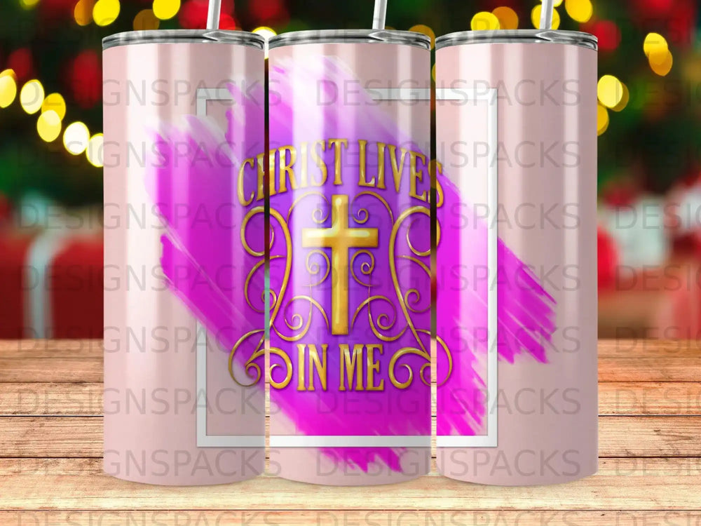 Gold cross with "Christ Lives In Me" text on a pink and purple gradient tumbler.
