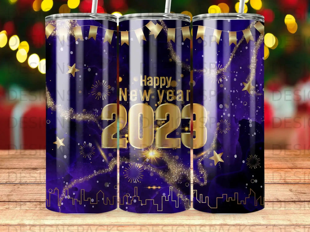 Happy New Year 2023 design on a dark blue tumbler with gold stars and fireworks.