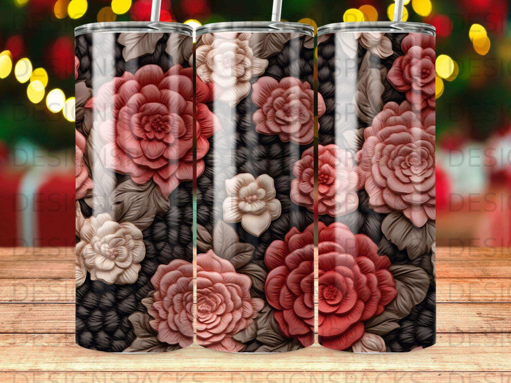 Floral pattern tumbler with muted red and cream roses on a black knit background.