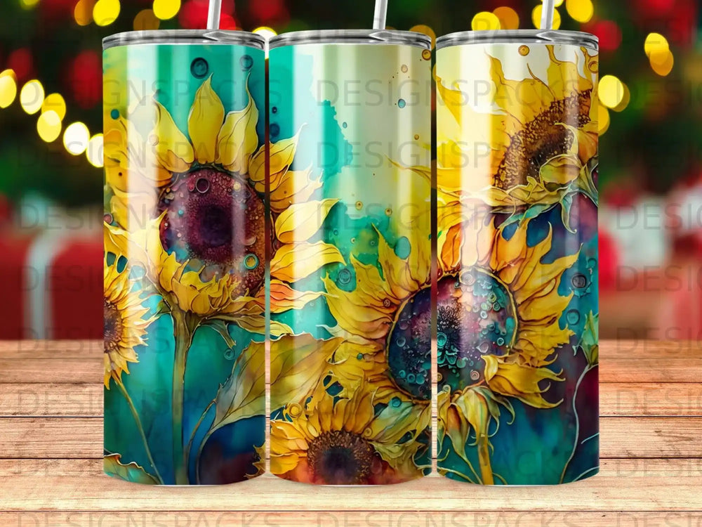 Three tall tumblers with a vibrant sunflower design.