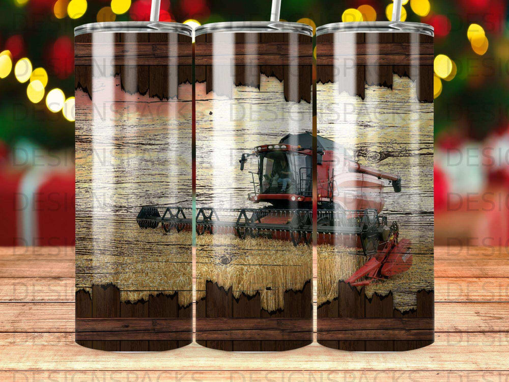 Red combine harvester on a wooden background with wheat stalks.