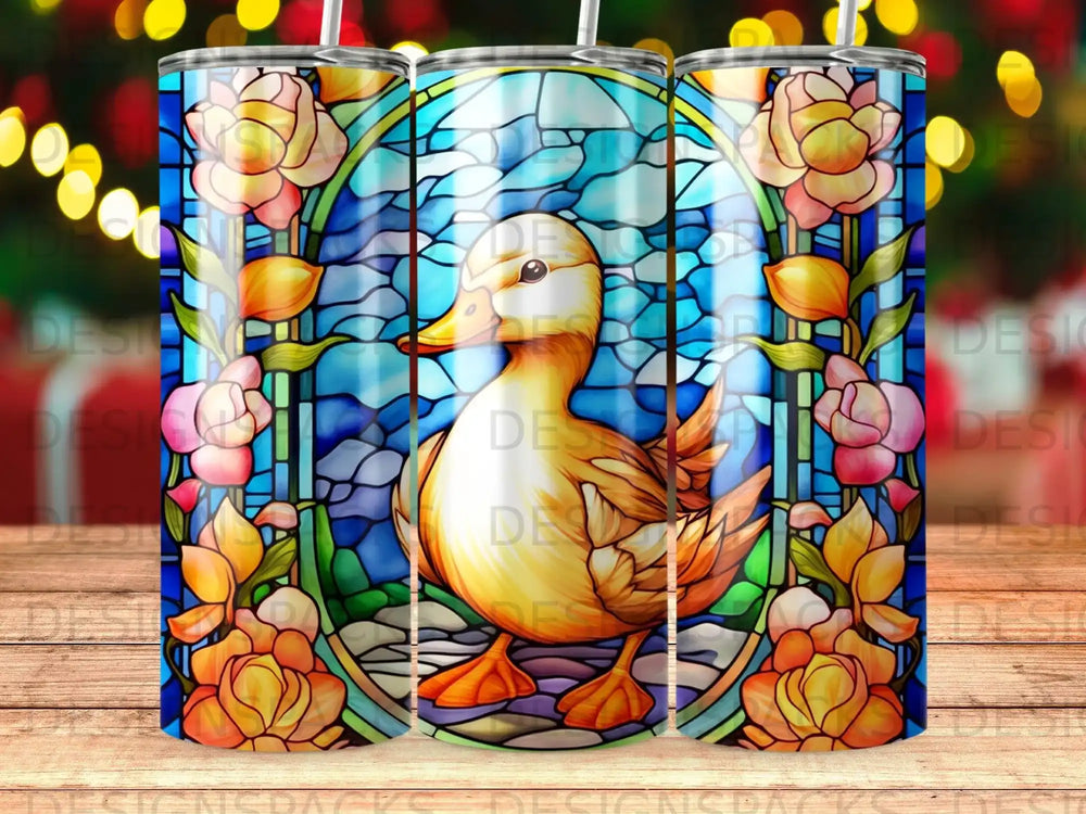 Stained glass duck surrounded by yellow and pink flowers, with bokeh lights in background.