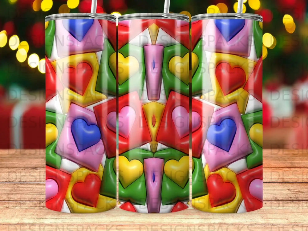 Tumbler with repeating pattern of colorful hearts and geometric shapes.
