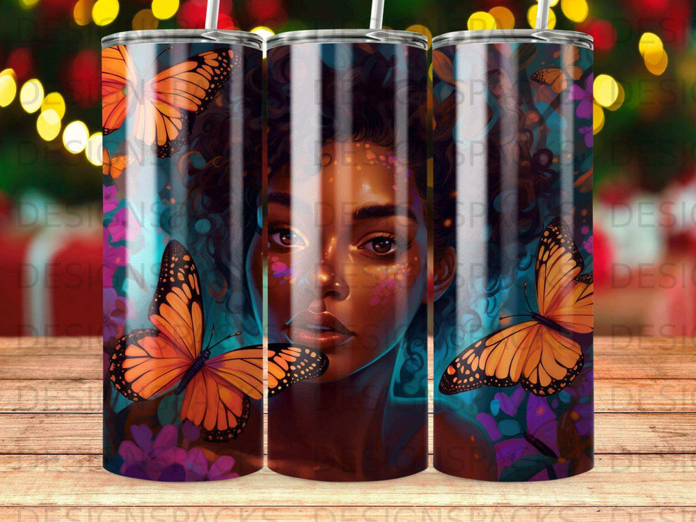 Tumbler with colorful butterflies and a woman's face.