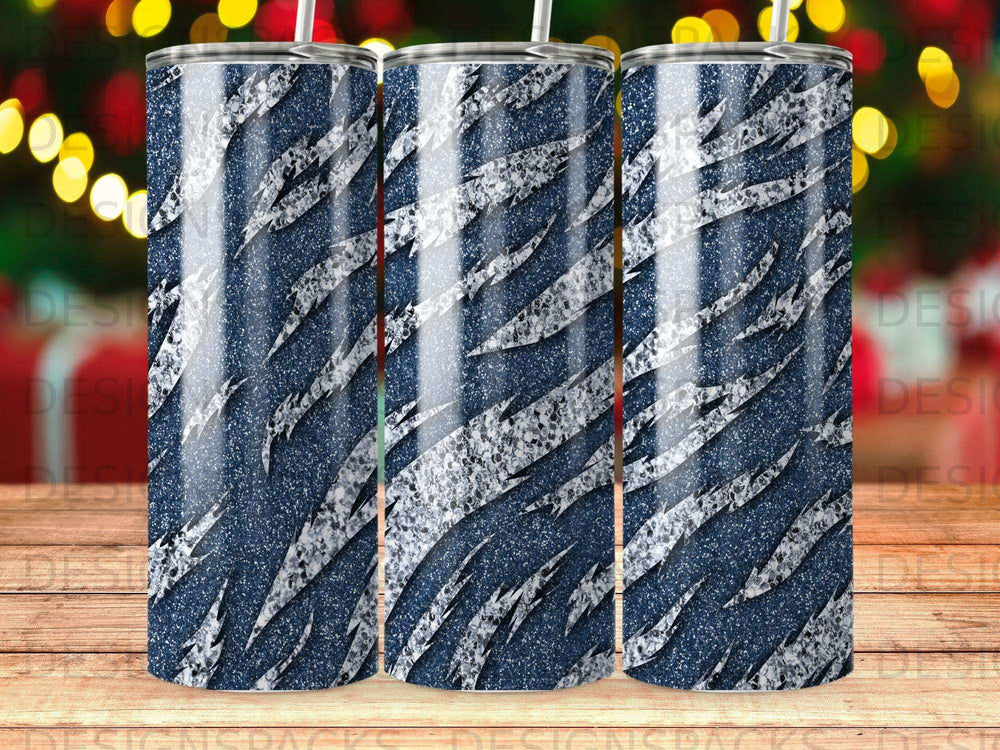 Tumbler with blue and silver glitter animal print design.