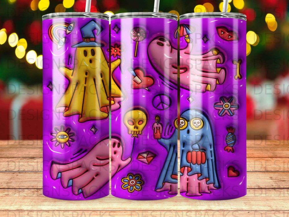 Three purple tumblers with colorful Halloween ghosts, skulls, and candy designs.