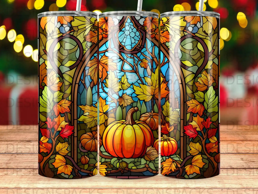 Stained glass tumbler with pumpkins and autumn leaves.