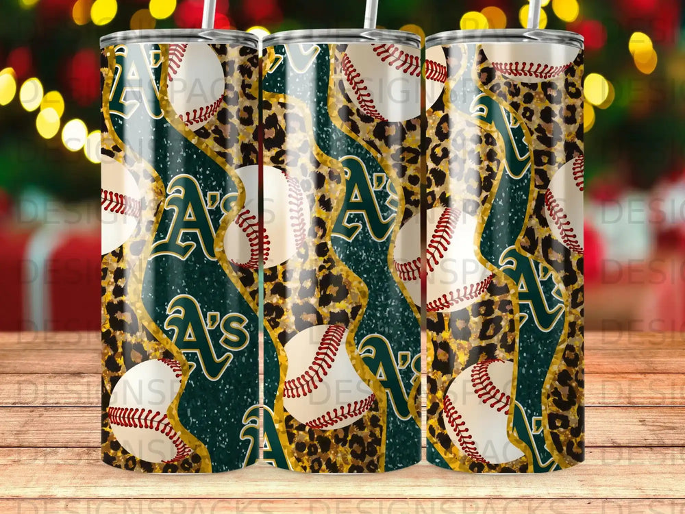 Green and gold Oakland Athletics logo with baseballs and leopard print on tumblers.