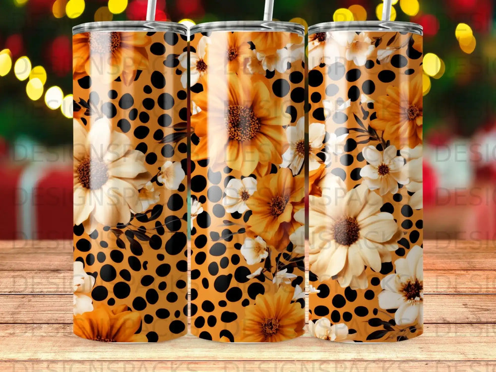 Orange and yellow floral pattern with black polka dots on a tumbler.