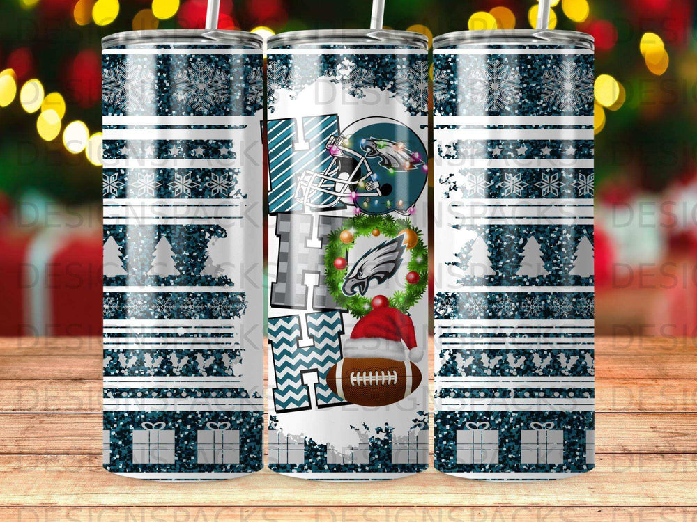 Green Eagles football helmet with Santa hat and Christmas snowflakes on tumbler.