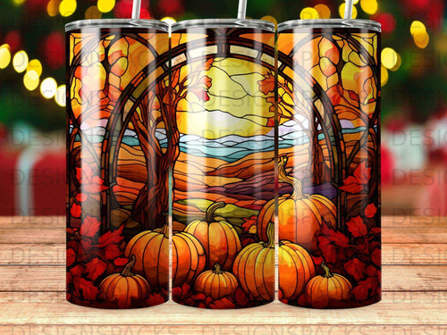 Fall harvest scene with pumpkins and stained glass art design on a tumbler.