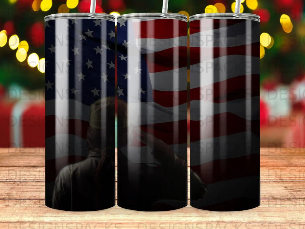 Person saluting American flag on a patriotic tumbler.