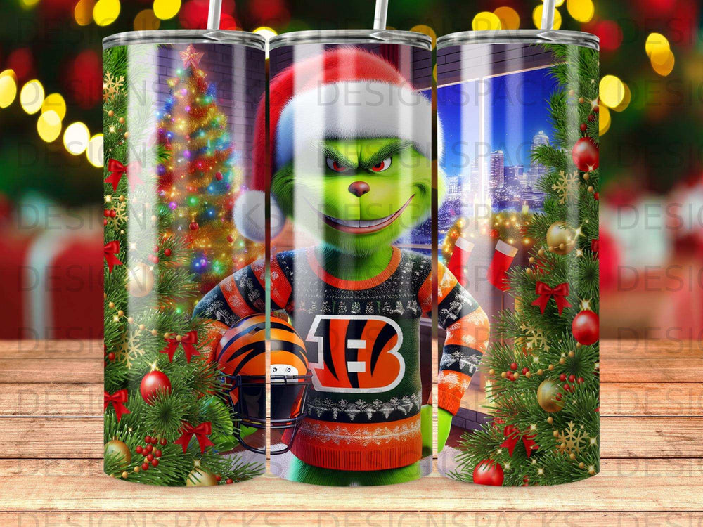 The Grinch wears a Cincinnati Bengals ugly Christmas sweater and hat with a festive background.