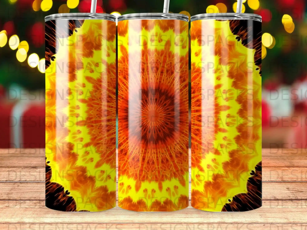Three tumblers with a radiating sunburst pattern on a wooden surface.