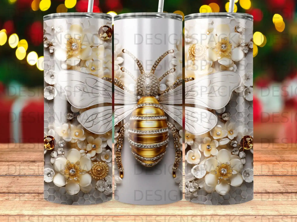 Gold bee with floral accents on a silver tumbler.