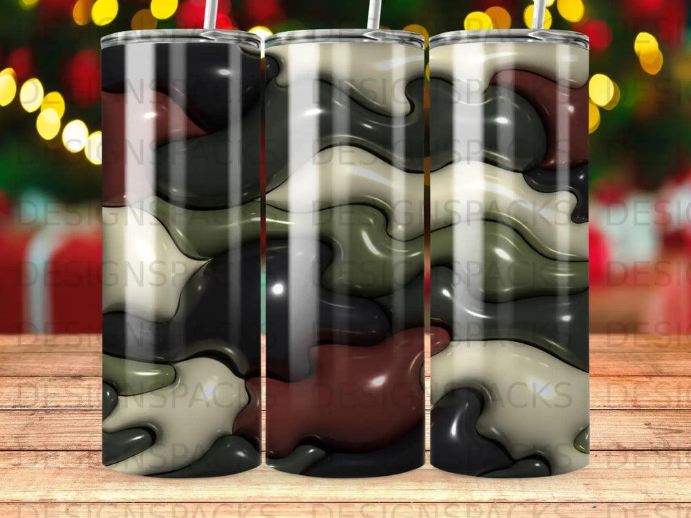 Abstract camouflage pattern on three tall, slender tumblers.