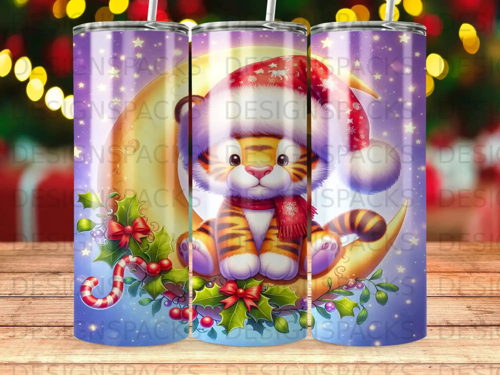Tiger cub in Santa hat sitting on crescent moon with holly and berries.