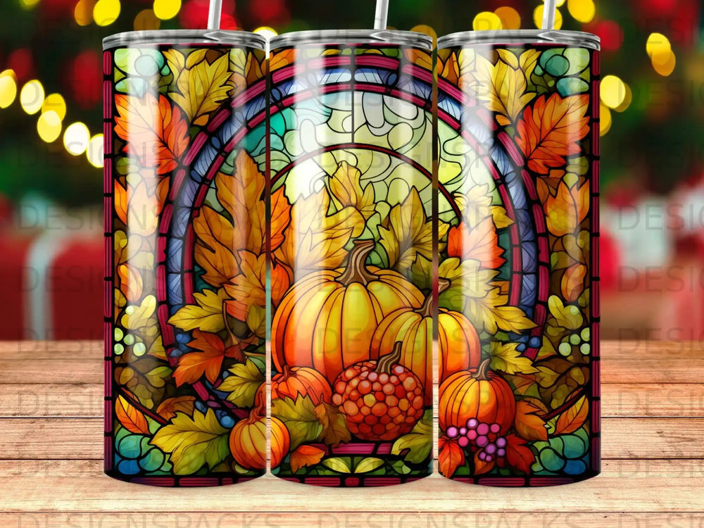 Stained glass tumbler with pumpkins, autumn leaves, and berries.