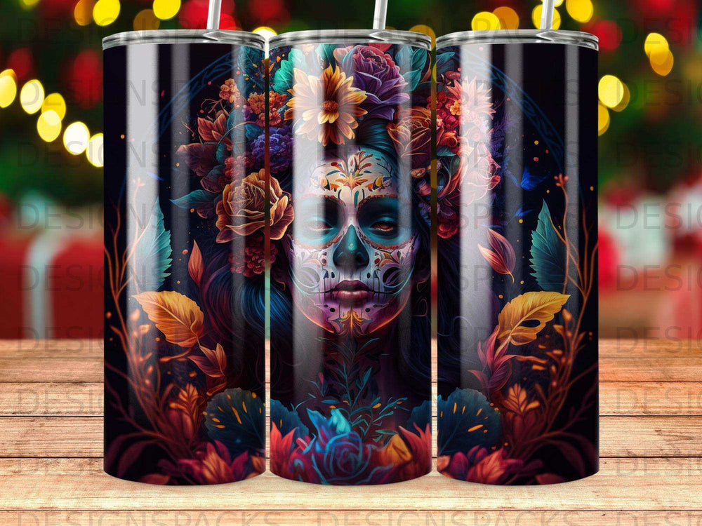 Sugar skull design on three tumblers with floral accents and dark background.