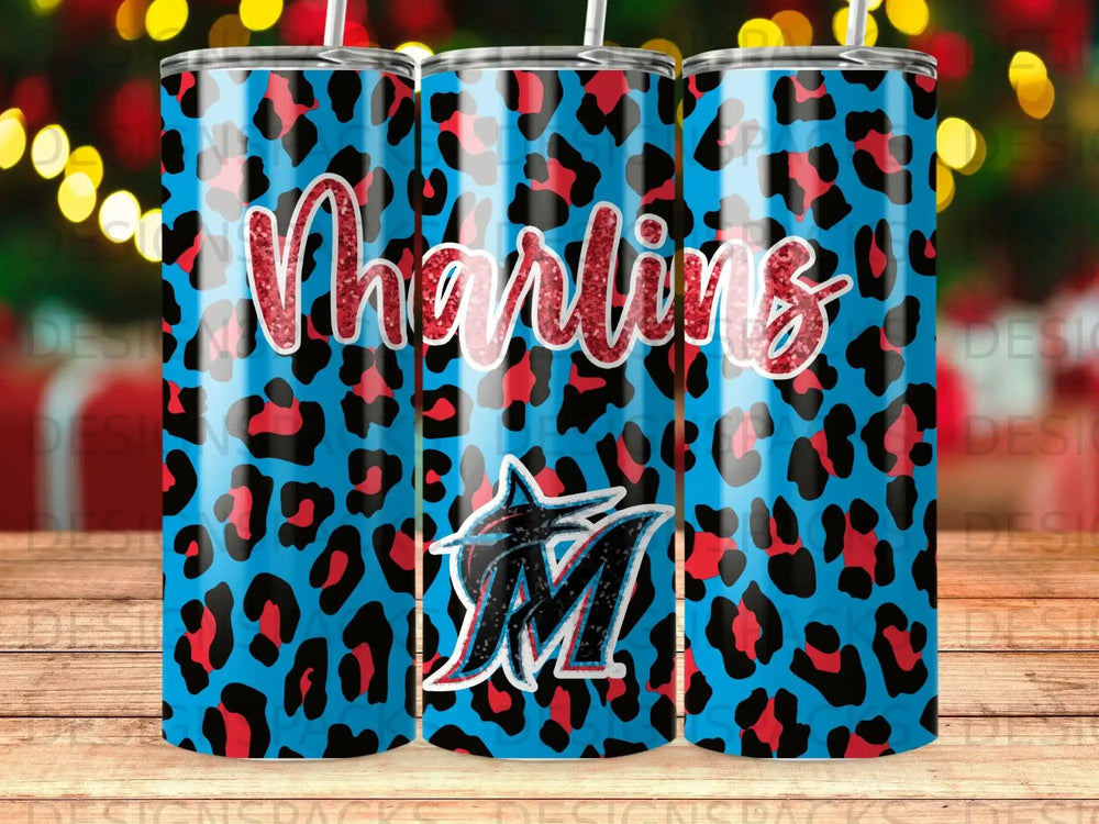 Blue leopard print tumbler with "Marlins" text and team logo.