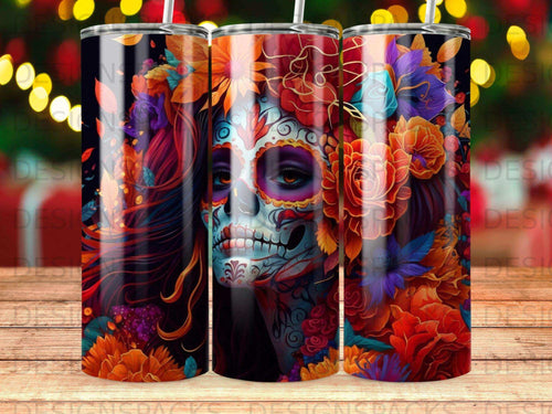 Sugar skull with colorful floral design and vibrant colors on a tumbler.