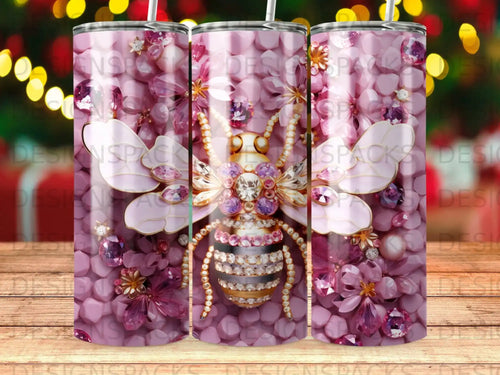 Pink floral tumbler with jewel-encrusted bee and subtle watermark.