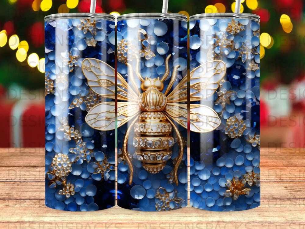 Gold bee and floral design on a blue textured background tumbler.